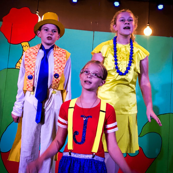 Three children singing at Summer Drama Camp in Orlando